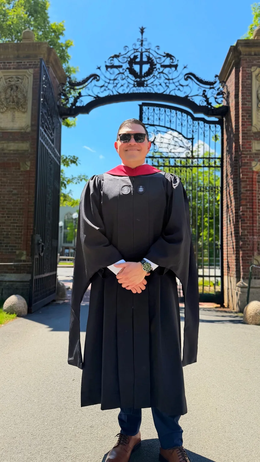 Jose R. Quiles at Johnston Gate in academic regalia