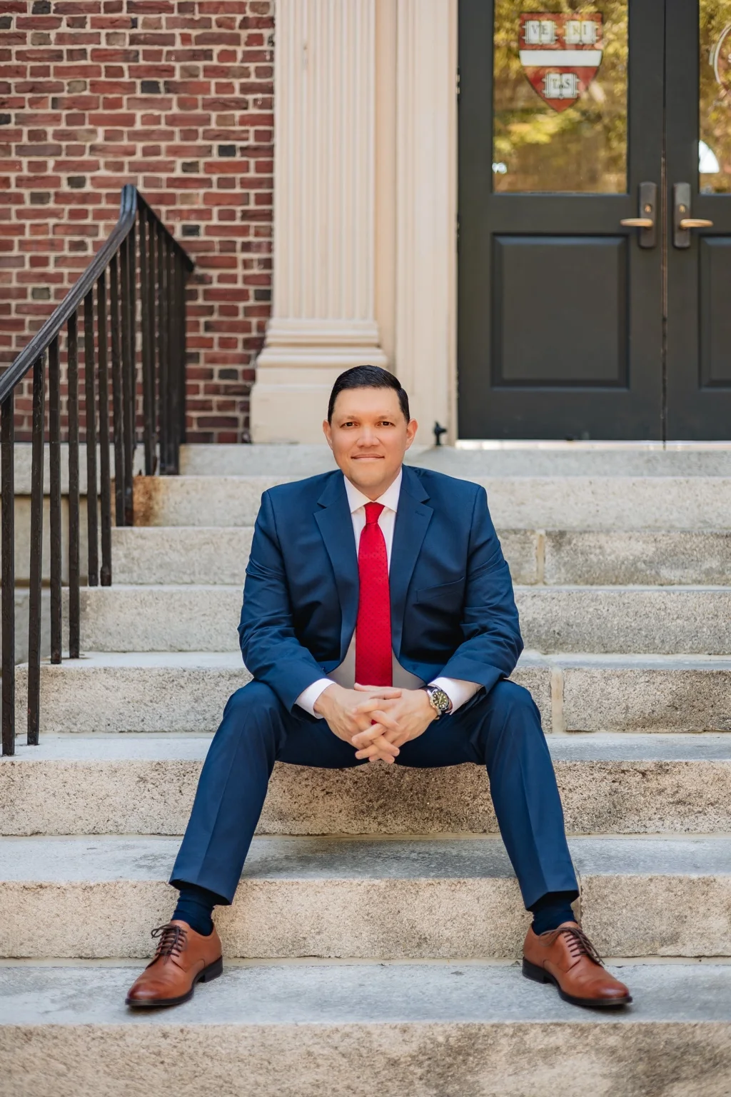 Jose R. Quiles seated in a navy suit
